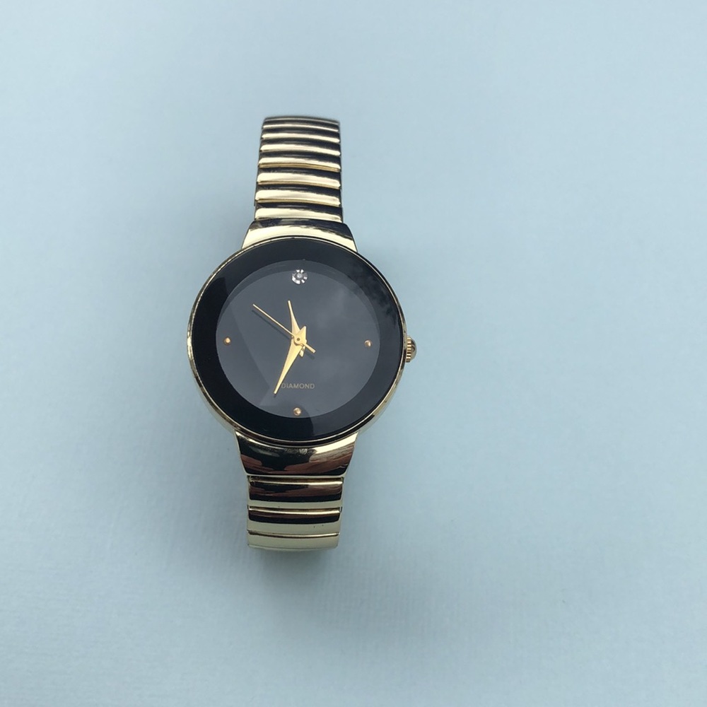 Diamond Bezel watch gold and black face
